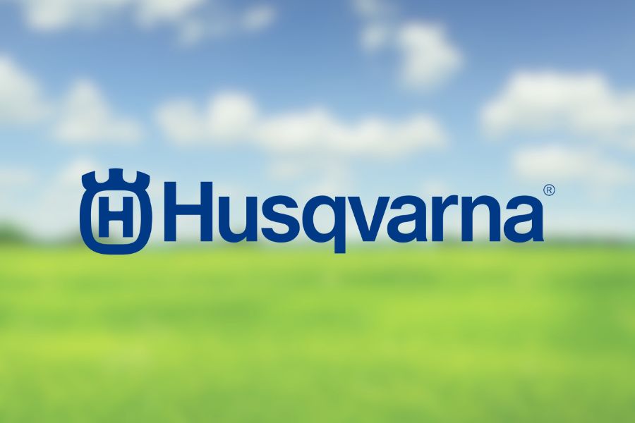Husqvarna logo with lawn background